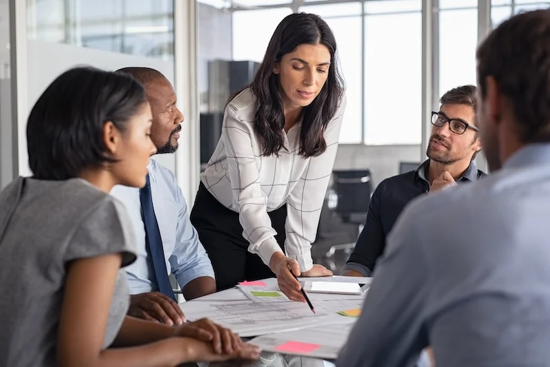 Woman working with team